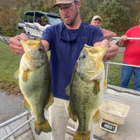 man holding fish 